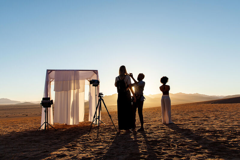 Crew silhouettes at sunrise — Namib production